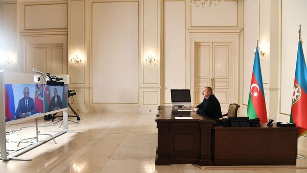 Президент Азербайджана Ильхам Алиев и Президент России Владимир Путин встретились в формате видеоконференции Президент Азербайджана Ильхам Алиев и Президент России Владимир Путин встретились в формате видеоконференции - Sputnik Азербайджан