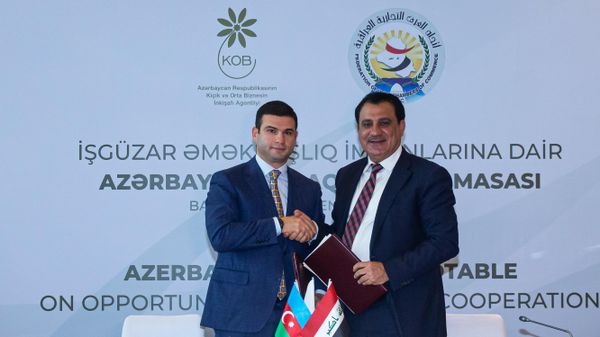 Председатель правления KOBIA Орхан Мамедов и президент Федерации торговых палат Ирака Абдулразак аль-Зухири - Sputnik Азербайджан