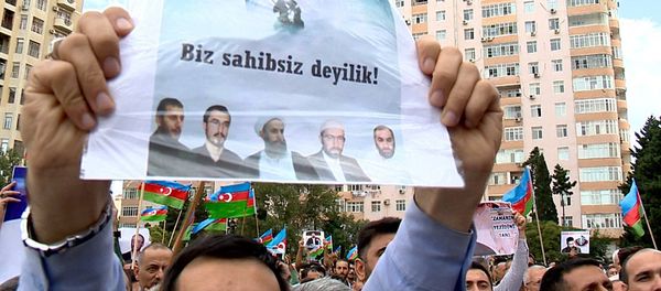 Участник митинга, организованного Национальным советом - Sputnik Азербайджан