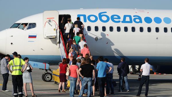 Самолет российской авиакомпании Победа в аэропорту Ростова-на-Дону, 11 июня 2015 года - Sputnik Азербайджан