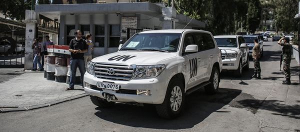 Инспекторы ООН по химоружию прибыли в военный госпиталь в Дамаске, где проходят лечение военнослужащие сирийской правительственной армии, пострадавшие от возможной химической атаки, 30 августа 2013 года - Sputnik Азербайджан