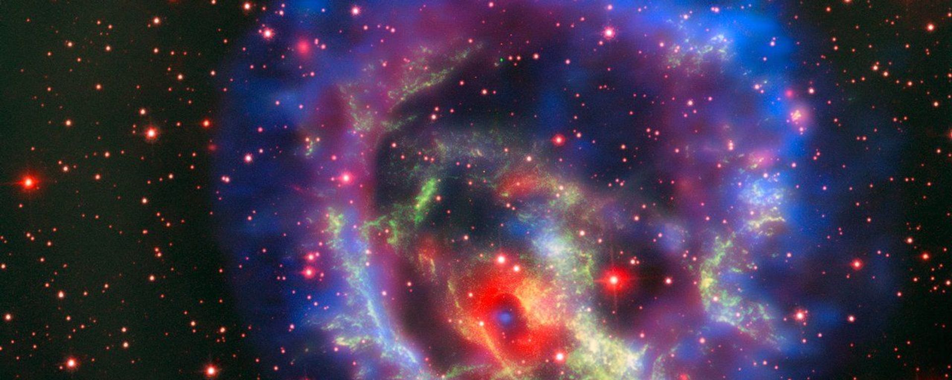 Остатки сверхновой 1E 0102.2-7219, расположенной в ближайшей к нам галактике Малое Магелланово Облако - Sputnik Азербайджан, 1920, 26.06.2023