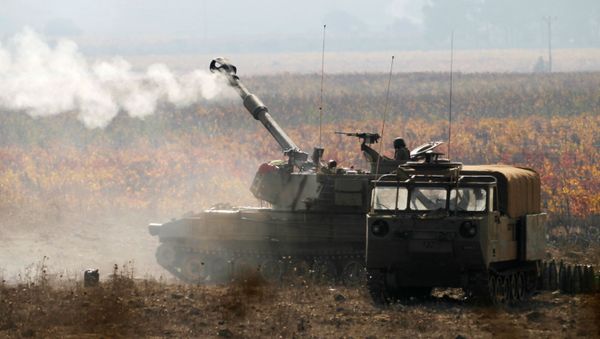 Израильские военные во время учений на границе с Сирией  - Sputnik Азербайджан